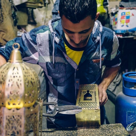 One of Mohammed Hani’s sons at work on a lantern