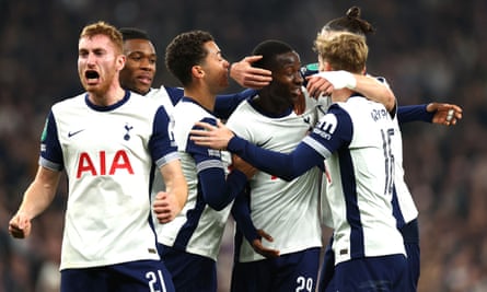 Tottenham players celebrate going 2-0 up against Manchester City in the first half.