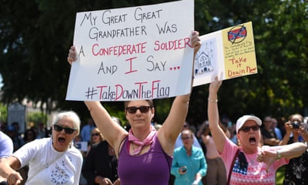 Protesters hold signs as they chant during a rally at the South Carolina statehouse in Columbia on Tuesday.