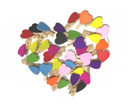 Multi coloured wooden mini heart pegs.