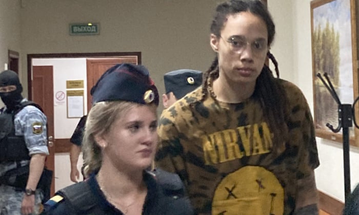 WNBA star and two-time Olympic gold medalist Brittney Griner is escorted to a courtroom for a hearing in the Khimki district court, just outside Moscow, Russia on Friday.