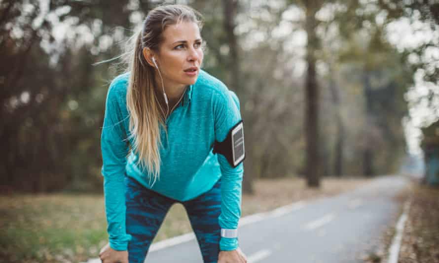 A woman resting while on a run