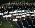 Military service members march in formation carrying rifles during a Pentagon POW/MIA ceremony