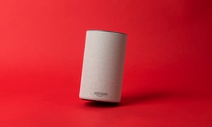 a picture of an amazon echo v2 tilted at a slight angle on a red background