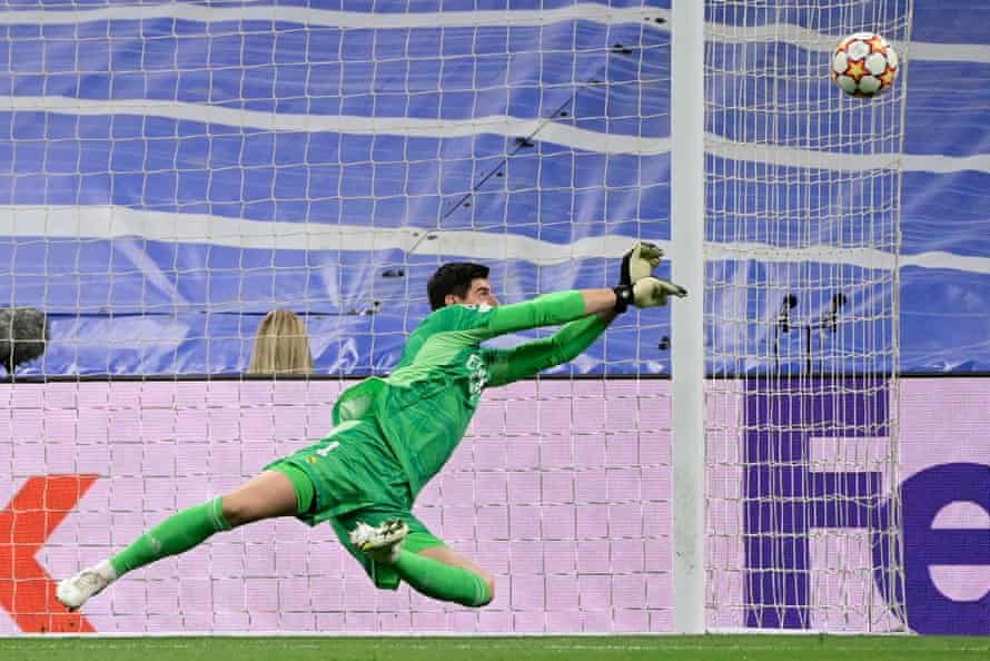 Real Madrid’s keeper Thibaut Courtois saves a shot from Bernardo Silva of Manchester City.