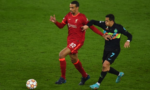 Liverpool’s Joël Matip holds off Internazionale forward Alexis Sánchez