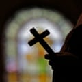 A crucifix and a stained glass window inside a Catholic church in New Orleans, Louisiana, on 1 December 2012.