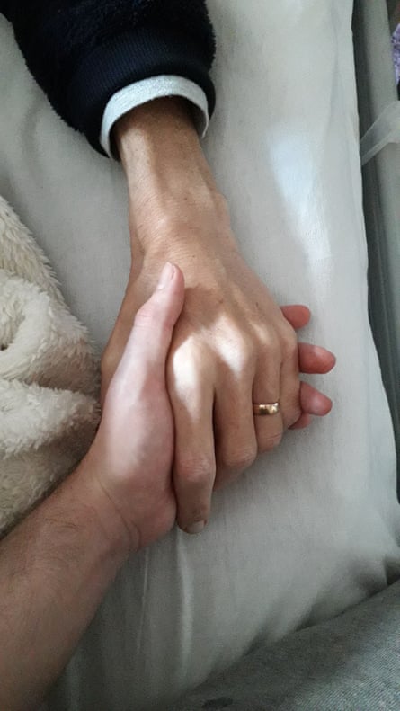 Robin and his father holding hands