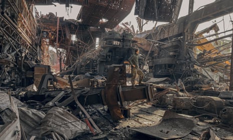 A Ukrainian soldier stands inside the ruined Azovstal steel plant in Mariupol before the surrender to Russian forces