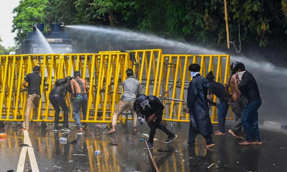 Police use a water canon to disperse students demanding the resignation of Sri Lanka's president,