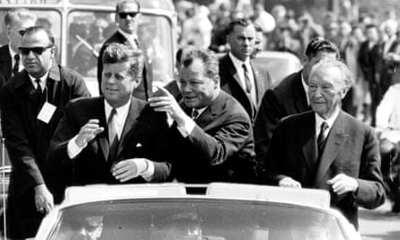 Willy Brandt, centre, then ruling mayor of West-Berlin, U.S. president John F. Kennedy, left, and German chancellor Konrad Adenauer, during sightseeing tour through Berlin, June 1963.