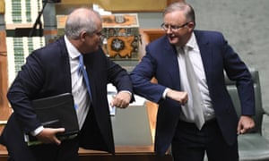 Scott Morrison and Anthony Albanese bump elbows after delivering their 2020 Christmas messages in the House of Representatives 