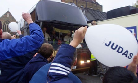 Tottenham fans greet the Arsenal coach carrying Sol Campbell on his first return to White Hart Lane in November 2001.