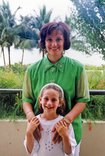 Radnor on holiday with her mum in the early 90s. Her mum is wearing a green shirt with diamanté hearts and Radnor is aged about six in a white top and wearing a white headband