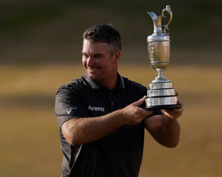 Ryan Fox of New Zealand with the trophy after his victory on day four of the Open Golf Championship.
