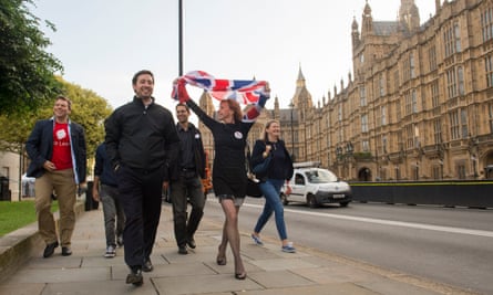 Leave supporters celebrate opposite the houses of parliament in London