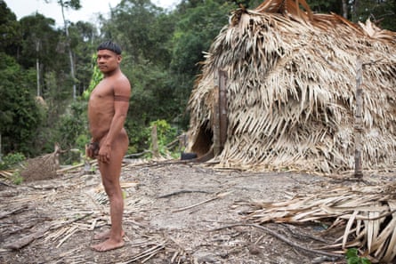 Indigenous Korubo man, Xuxu, in loin cloth outside the village maloca (long house), April 2018.