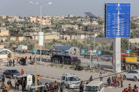 Trucks carrying medicine and humanitarian aid to civilians in Gaza enter through the Karm Abu Salem crossing.