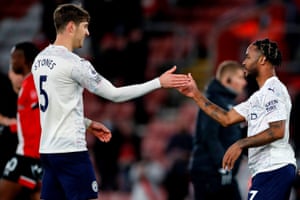 John Stones celebrates with Raheem Sterling after the win.