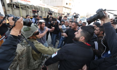 Tension rises between Jewish settlers under the protection of Israeli forces and Palestinians in the northern West Bank town of Huwara.
