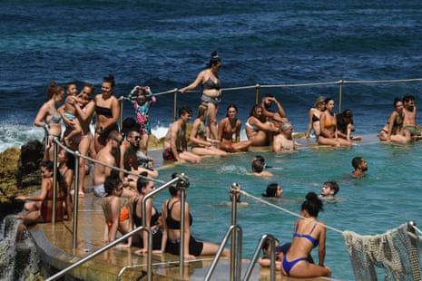 People cool off in the pool at Bronte Beach in Sydney on Saturday. People are being urged to stay 1.5 metres away from others.