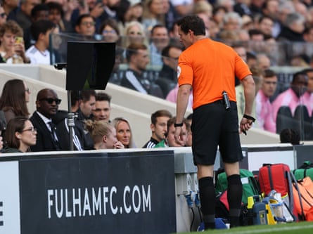 Darren England watching a replay during Fulham v Newcastle United at Craven Cottage in October.