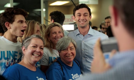 Democratic candidate Jon Ossoff has his picture taken with supporters in Chamblee, Georgia Monday.