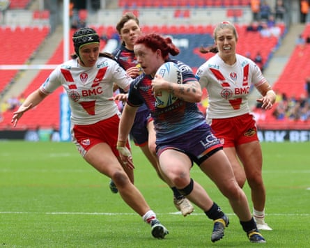 Wigan Warriors’ Eva Hunter surges forward to score a try at Wembley.