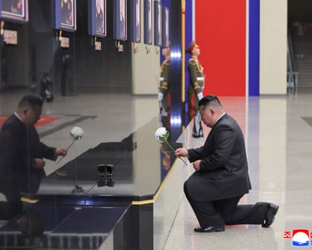 The North Korean leader paying his respects in front of portraits of fallen North Korean soldiers at the April 25 House of Culture in Pyongyang