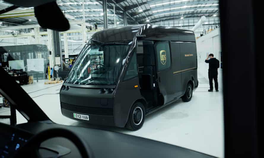 Arrival’s futuristic looking electric van painted in familiar brown and gold UPS livery, as seen through the windscreen of another van
