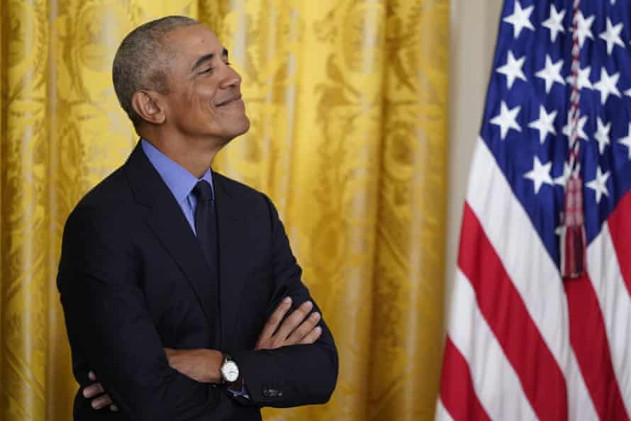 Barack Obama looks on as President Joe Biden speaks in the East Room of the White House on Tuesday.