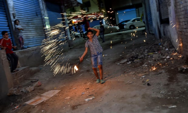 Egyptian children play with fireworks at the start of Ramadan.