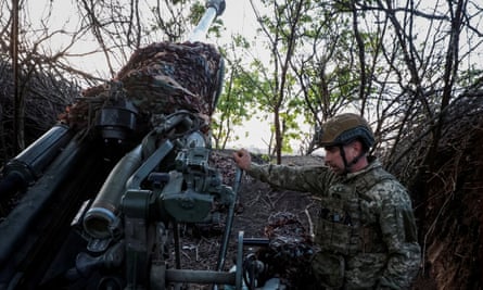 A member of the 1148th separate artillery brigade of air assault troops of Ukraine prepares a M777 howitzer in the Donetsk region.