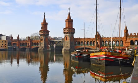 Bridge and colourful old sailing boats