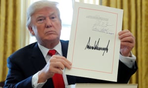 Trump signs his tax cut into law in December.