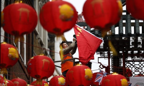 The Chinese flag is hung in London’s Chinatown ahead of the visit of Xi Jinping. The president will also be greeted by protests over human rights violations in China. 
