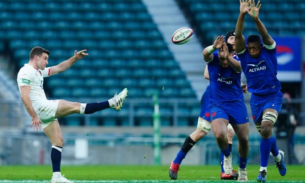 George Ford of England kicks despite French pressure in Autumn Nations Cup final.