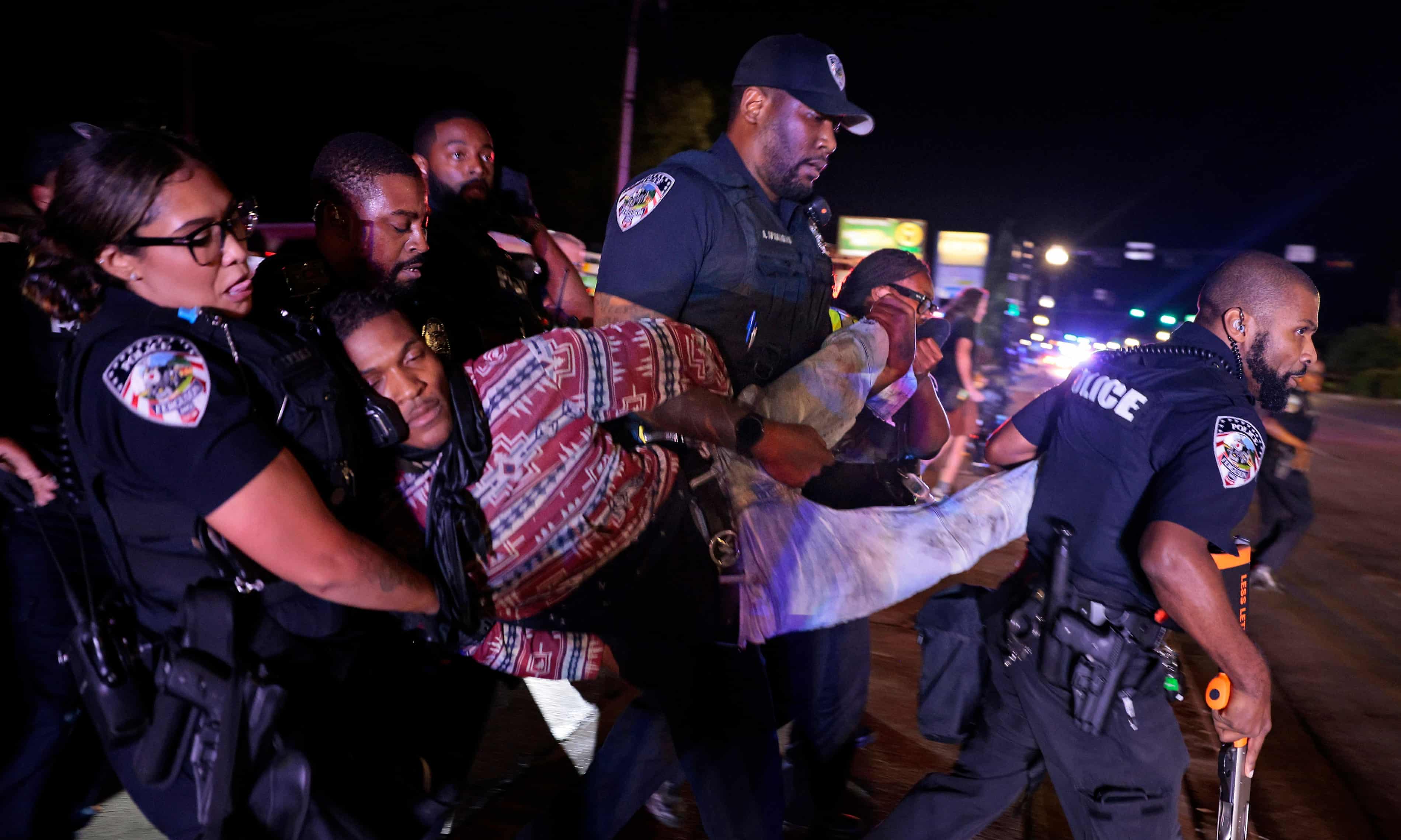 Ferguson police officer suffers critical brain injury in Michael Brown anniversary violence (theguardian.com)