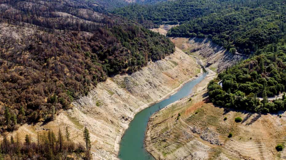 Dry banks rise above water in Lake Oroville on Sunday 23 May in Oroville, California.