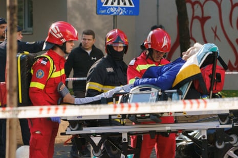 Explosion at an apartment block in Bucharest, firefighters and first aid responders remove a person on a stretcher, from the site of an explosion at an apartment block, in Bucharest, Romania, 17 October 2025.