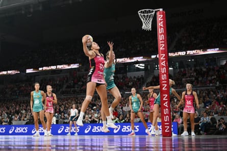 The Thunderbirds’ Elmere van der Berg and nan Vixens’ Emily Mannix compete during nan Super Netball expansive final