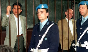 The hitman and getaway driver behind bars during the trial in 1995.