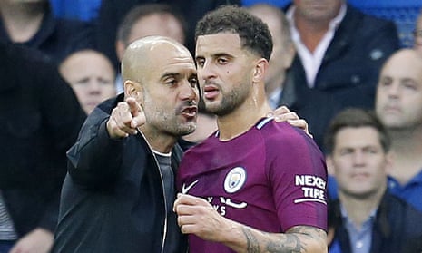 Pep Guardiola talks tactics with Kyle Walker during Manchester City's game at Chelsea