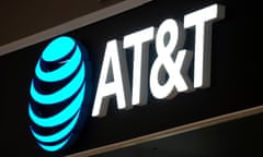 An AT&T sign is seen at a store in the US