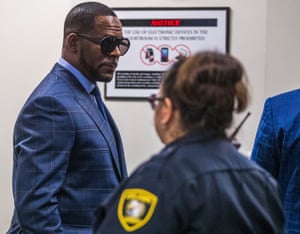 Illinois, USR. Kelly appears in court for failure to pay more than $161,000 in back child support. He was taken into custody to be returned to the Cook County Jail.