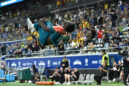 Nestory Irankunda celebrates scoring for the Socceroos against Brazil in Townsville