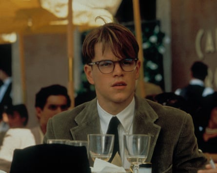 Matt Damon in glasses and a suit at a restaurant table in a shot from The Talented Mr Ripley