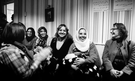 Volunteers from Nagu and refugees laugh together during a New Year’s Eve concert put on by local musicians.