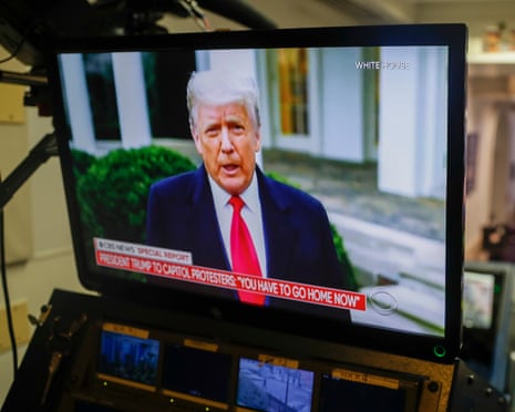 Donald Trump on a monitor in the White House.