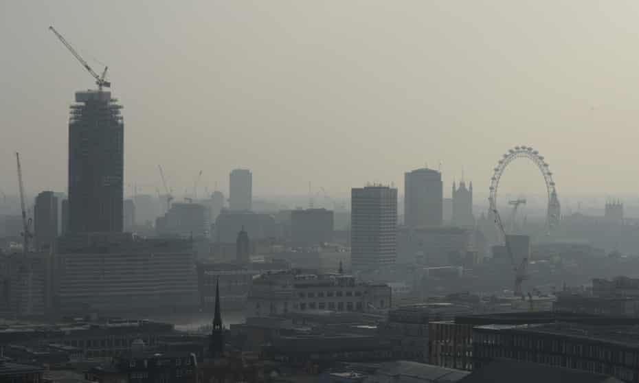 Air pollution obscures the view of the London eye in central London